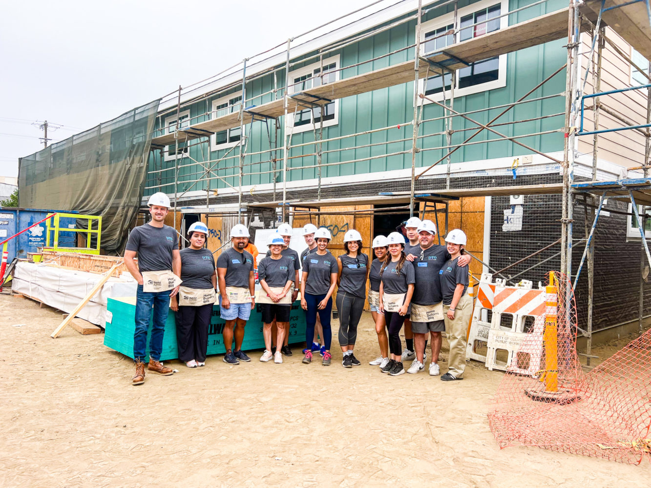 DTO team standing at a construction site.